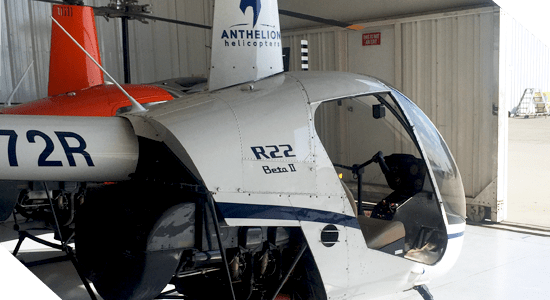 a small airplane is parked on the side of a building