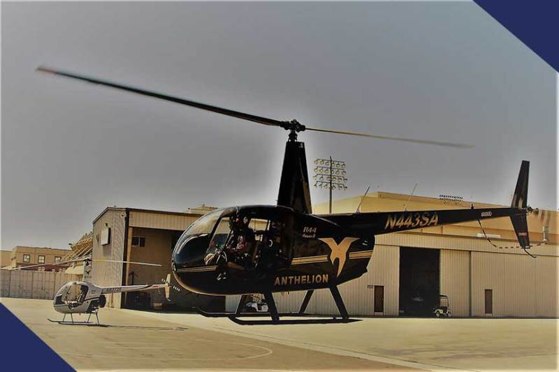 a helicopter parked in a parking lot