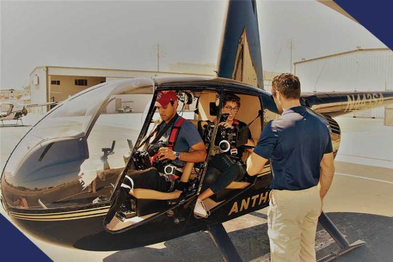 a man standing in front of a car