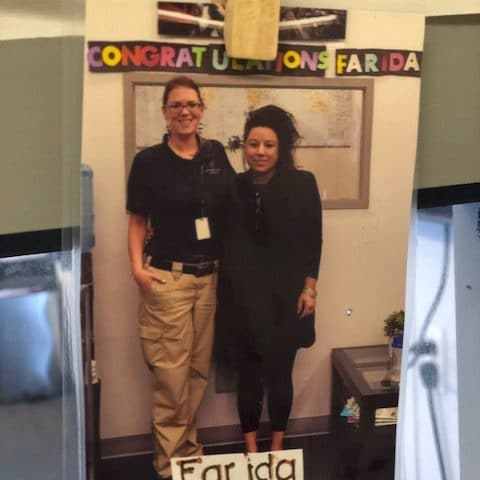 a man standing in front of a refrigerator