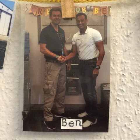 a man standing in front of a building