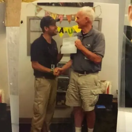 a group of people standing in a room