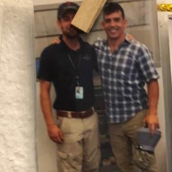 a man standing in front of a building