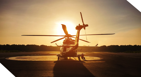 a plane sitting on the tarmac at sunset