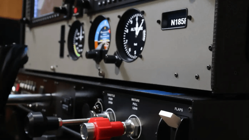 Close-up of aircraft cockpit controls and gauges.