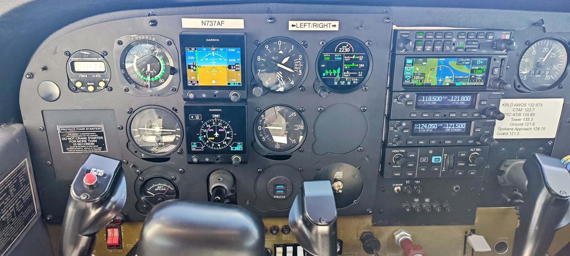 Cockpit dashboard with various flight instruments and controls.